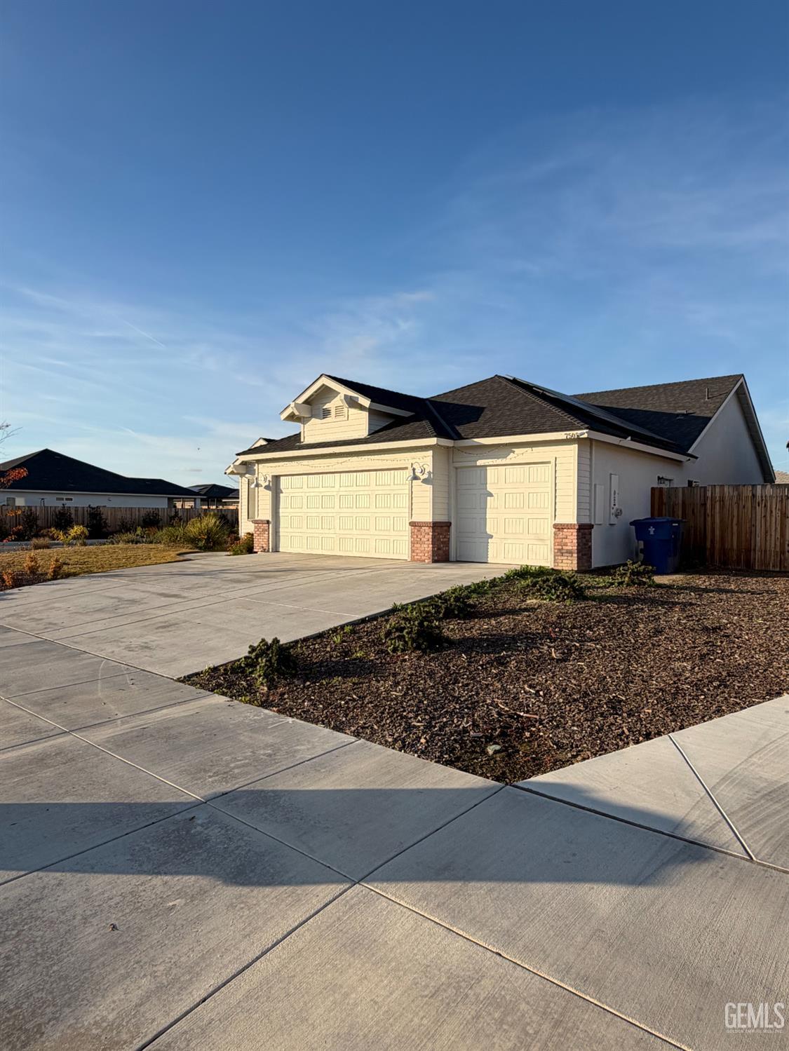 Undisclosed Address Bakersfield, CA 93313 - Photo 3 of 24 a front view of a house with a yard