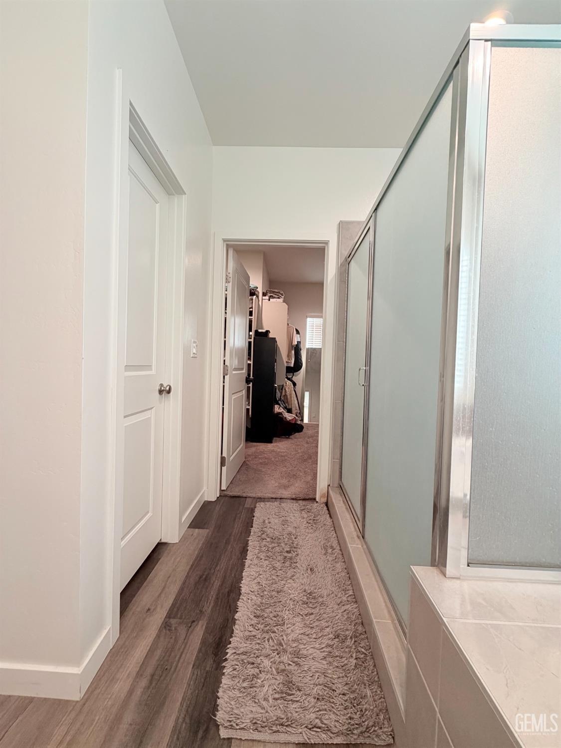 Undisclosed Address Bakersfield, CA 93313 - Photo 6 of 24 a view of a hallway with wooden floor and closet