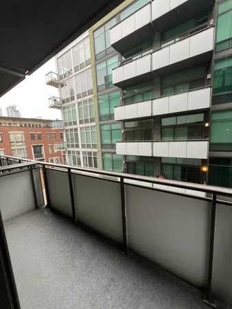 a view of a large window with an outdoor seating