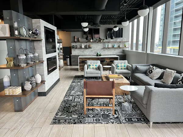 a living room with lots of furniture and a wooden floor