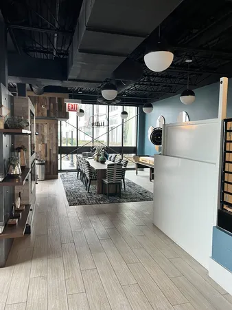 a lobby with furniture and a rug
