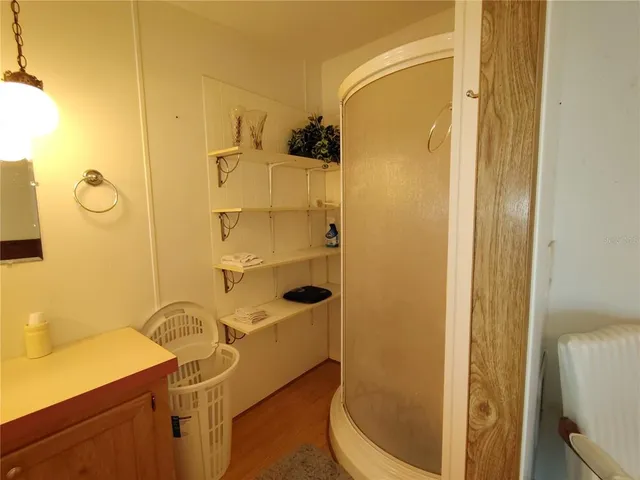 a bed room with a bed and a chair