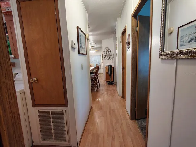 a bedroom with bed and a chandelier
