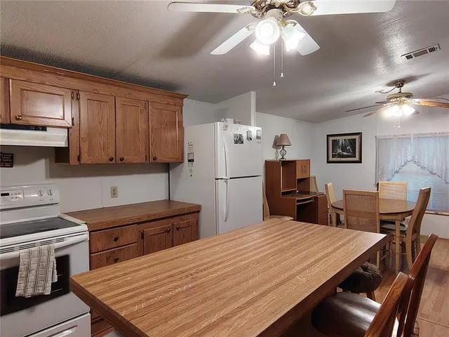 a view of a park with large trees