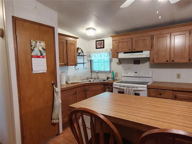 a view of a chair and table in the garden