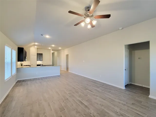 a view of a livingroom with a kitchen