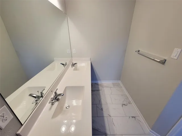 a bathroom with a tub and shower
