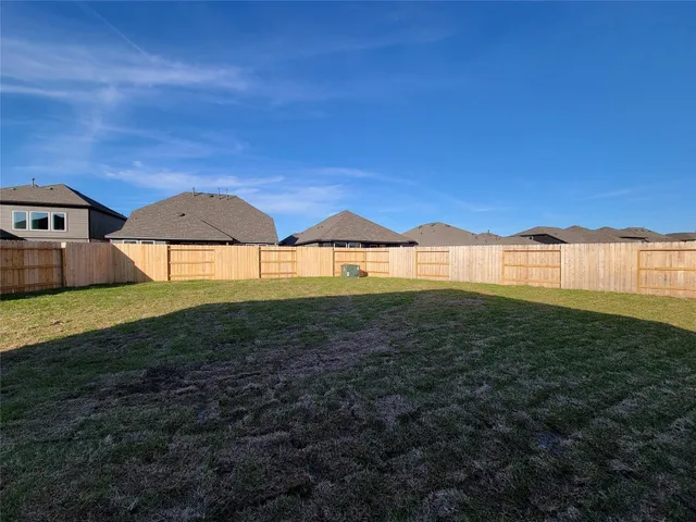 a view of a backyard of a house