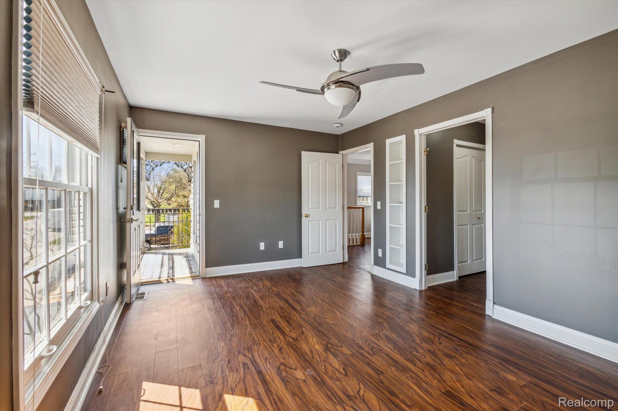 Primary Bedroom With Door To Private Deck