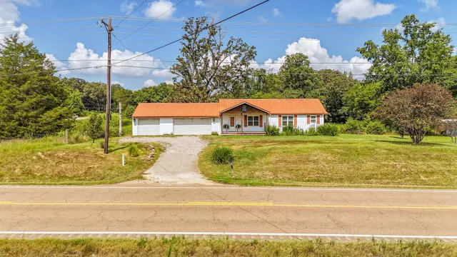 a view of a swimming pool with a yard
