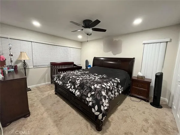 a bed room with a bed and a couch