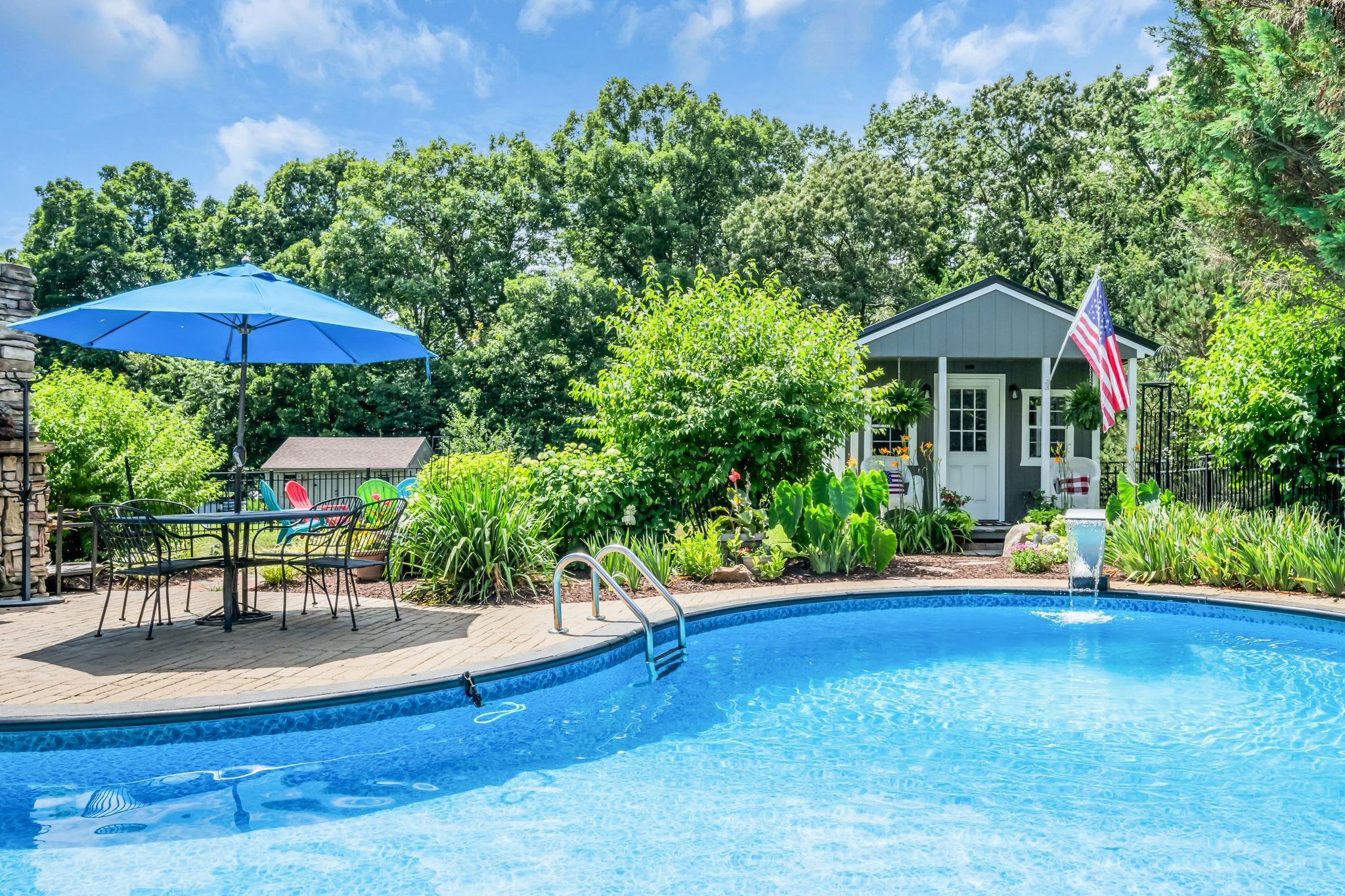 125 Lena Loop Burns, TN 37029 - Photo 13 of 55 Just beyond the pool fountain you will find another retreat. This finished building is set up as a gym but has many possibilities.