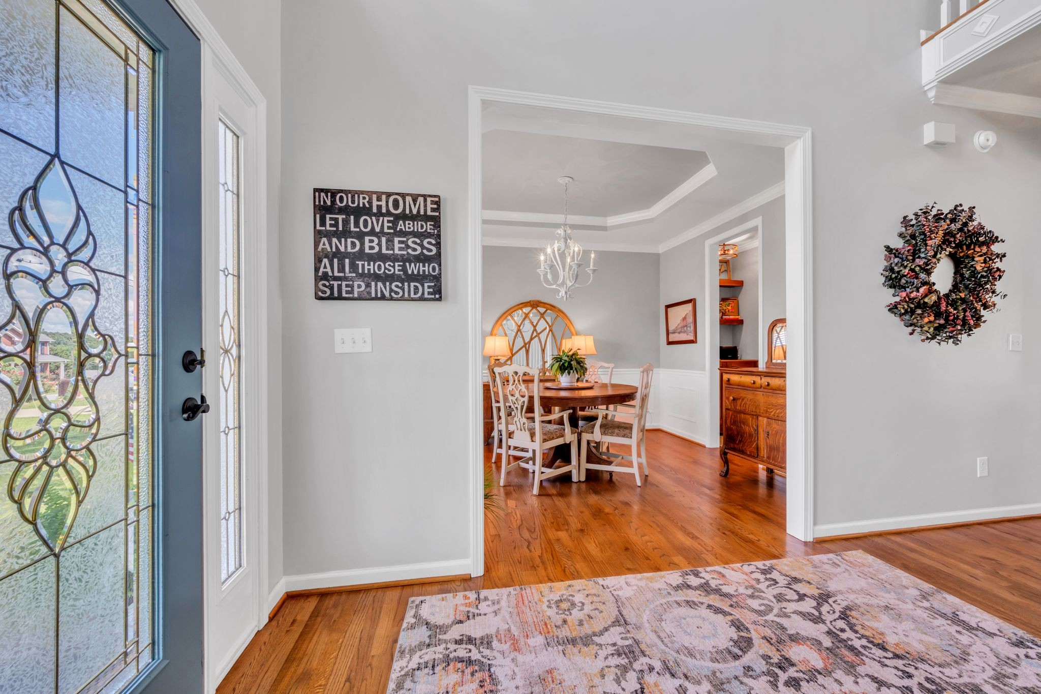 125 Lena Loop Burns, TN 37029 - Photo 18 of 55 a bedroom with a bed and a bookshelf with wooden floor
