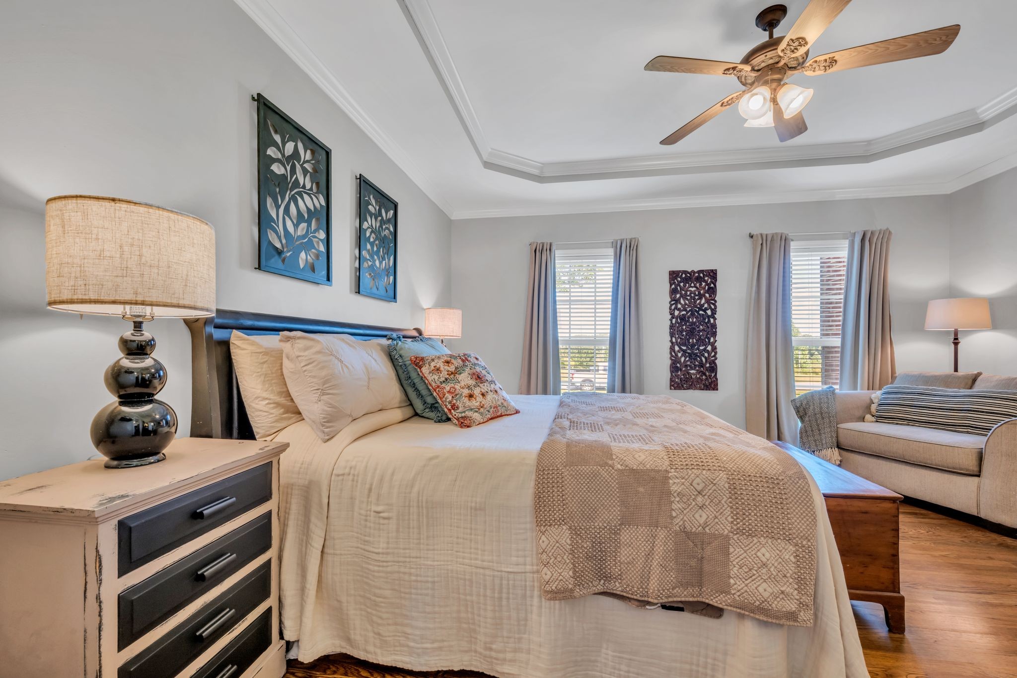 125 Lena Loop Burns, TN 37029 - Photo 35 of 55 a bedroom with a bed and wooden floor