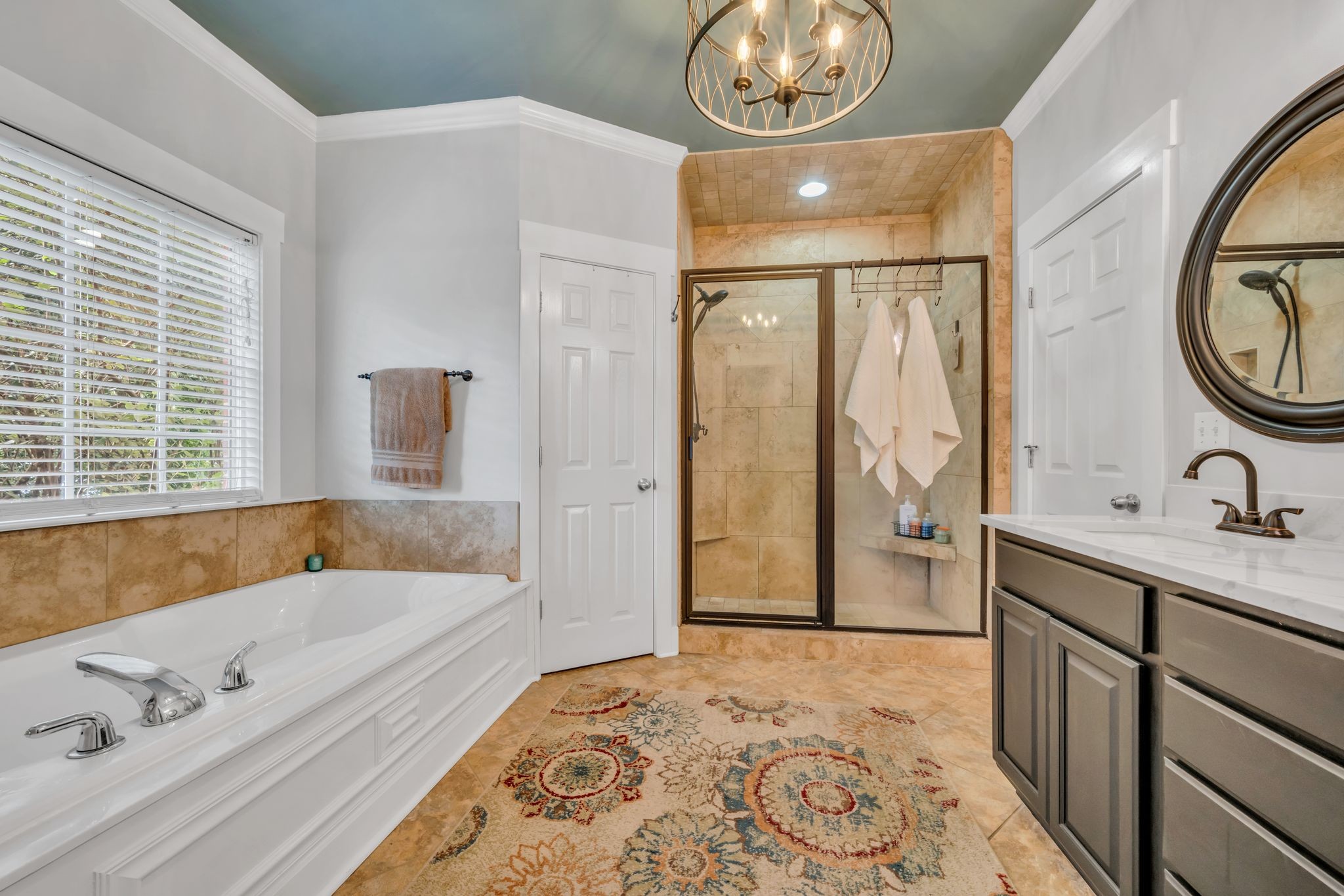 125 Lena Loop Burns, TN 37029 - Photo 37 of 55 a bathroom with a tub sink and mirror