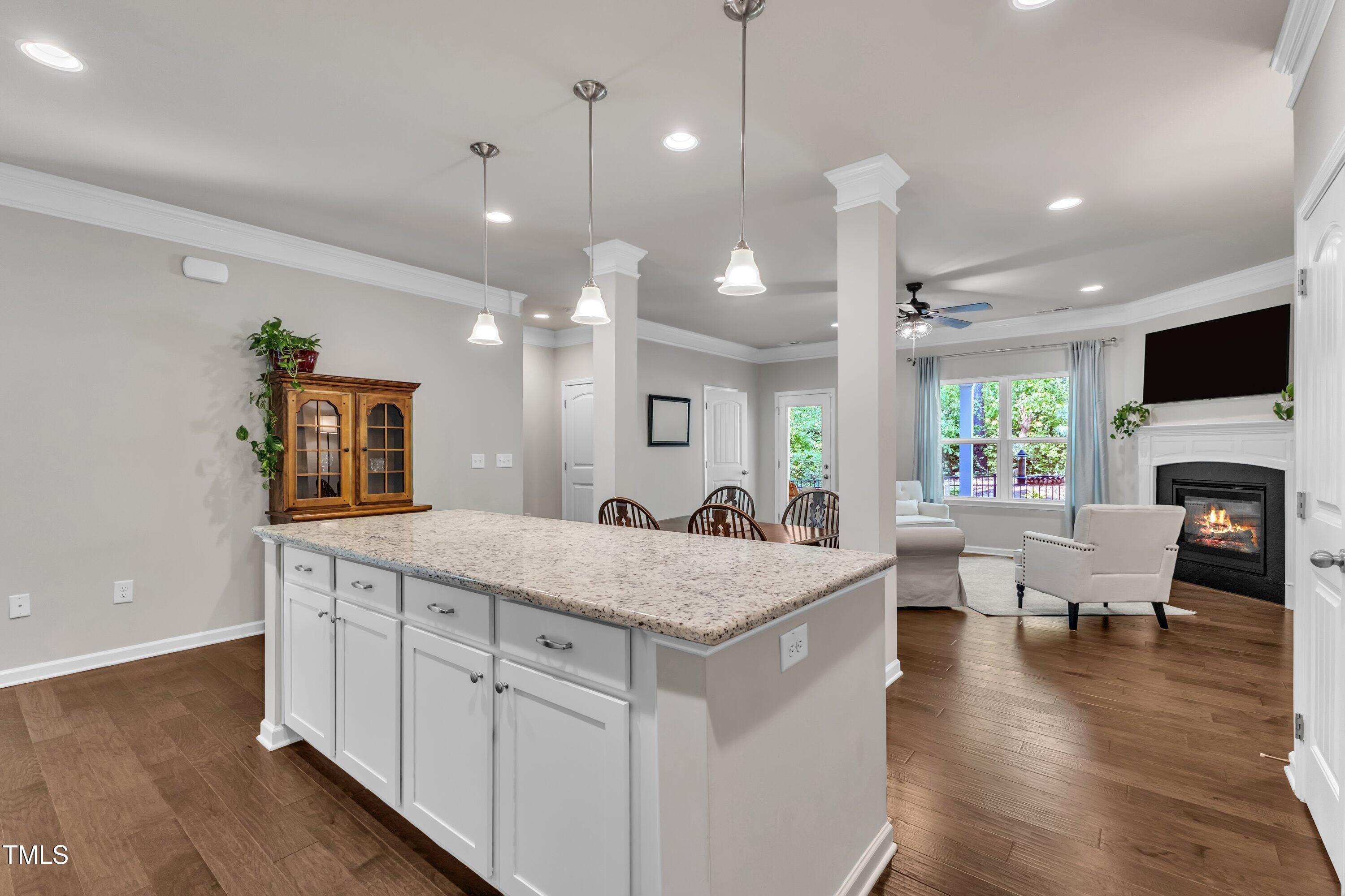 1230 Wingstem Place Raleigh, NC 27607 - Photo 10 of 41 a view of living room and kitchen with a wooden floor