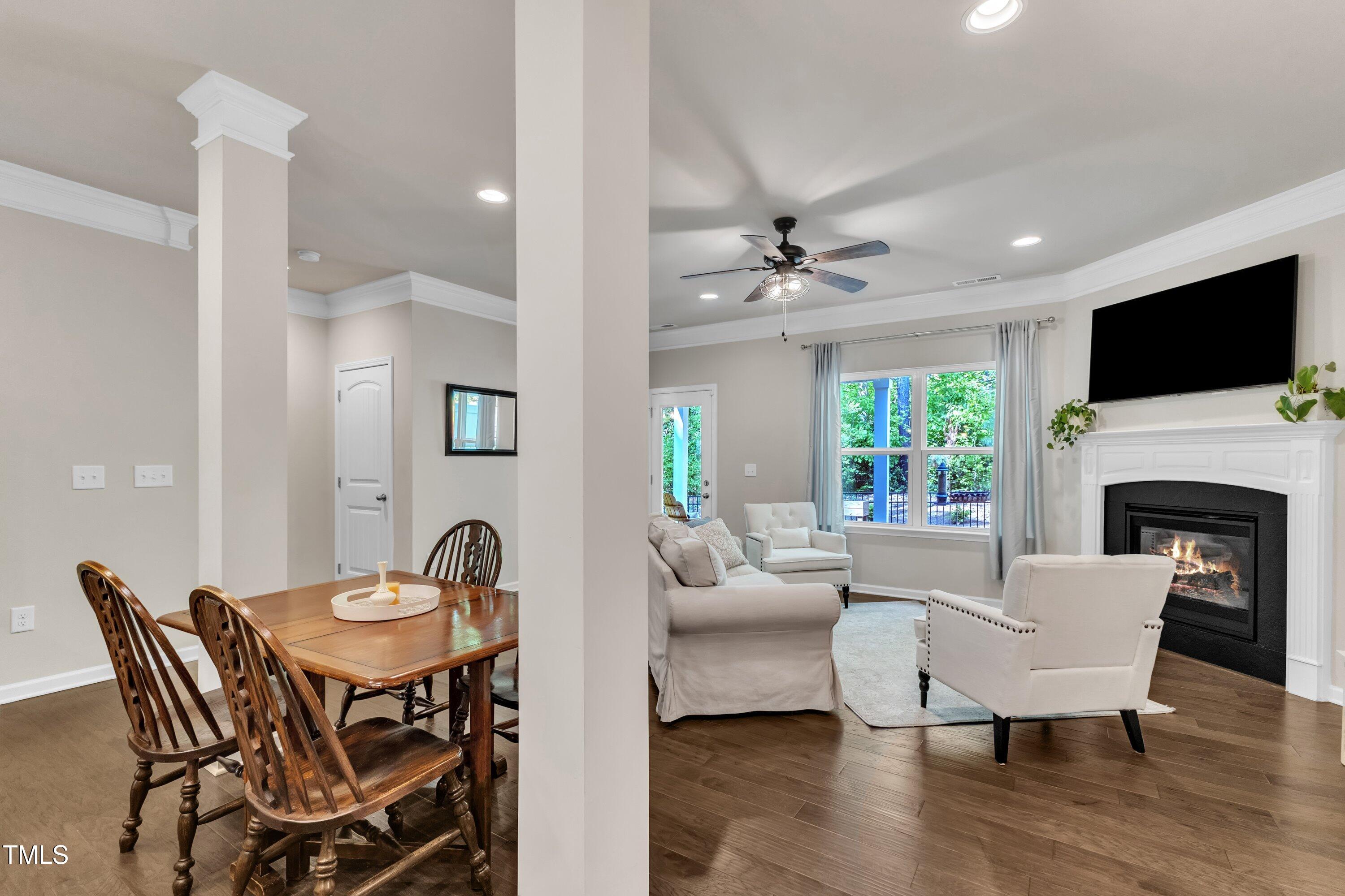 1230 Wingstem Place Raleigh, NC 27607 - Photo 15 of 41 a view of a dining room with furniture window and wooden floor