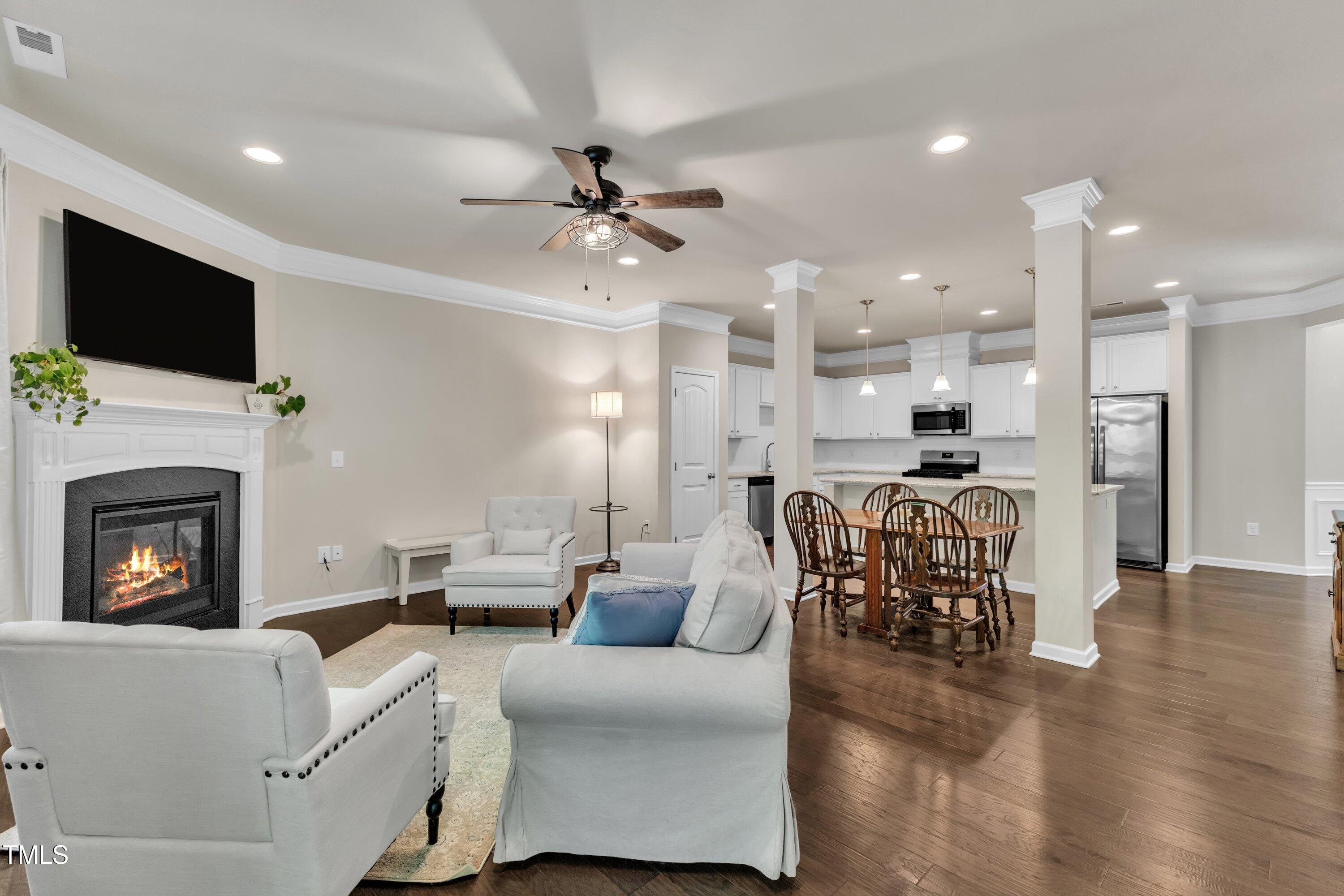1230 Wingstem Place Raleigh, NC 27607 - Photo 18 of 41 a living room with furniture fireplace and flat screen tv