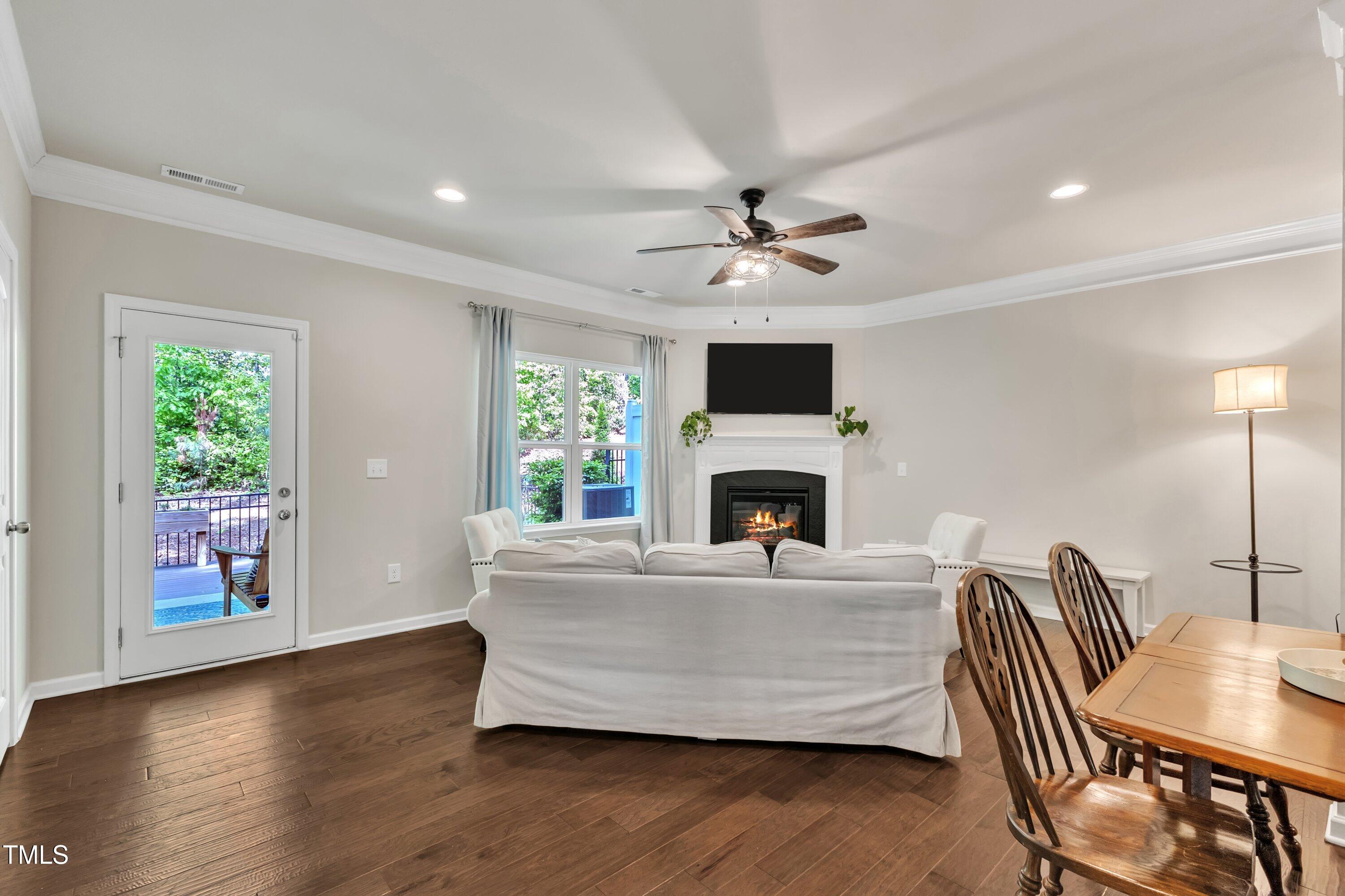 1230 Wingstem Place Raleigh, NC 27607 - Photo 19 of 41 a living room with furniture and a fireplace