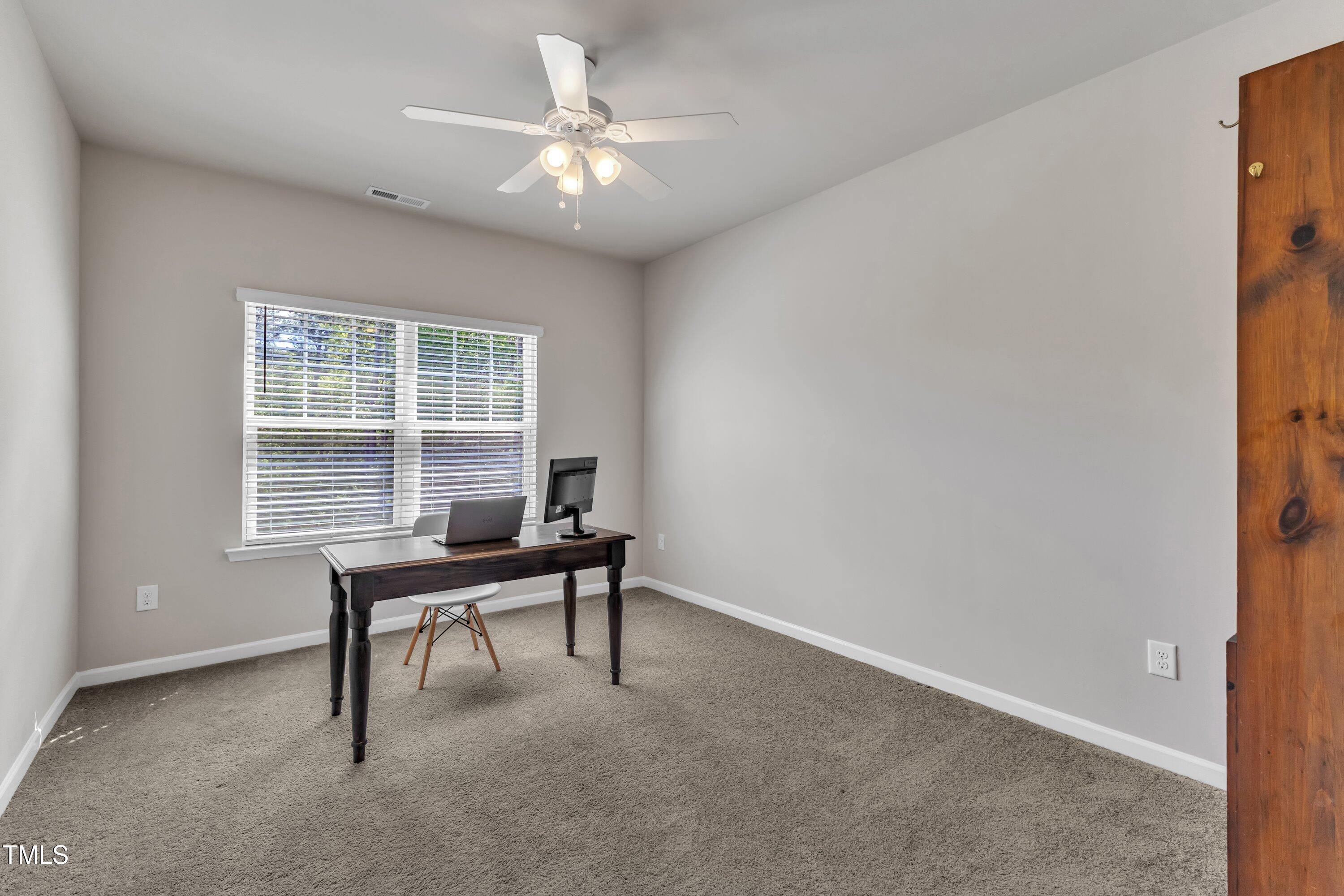 1230 Wingstem Place Raleigh, NC 27607 - Photo 28 of 41 a view of a workspace with furniture and a window