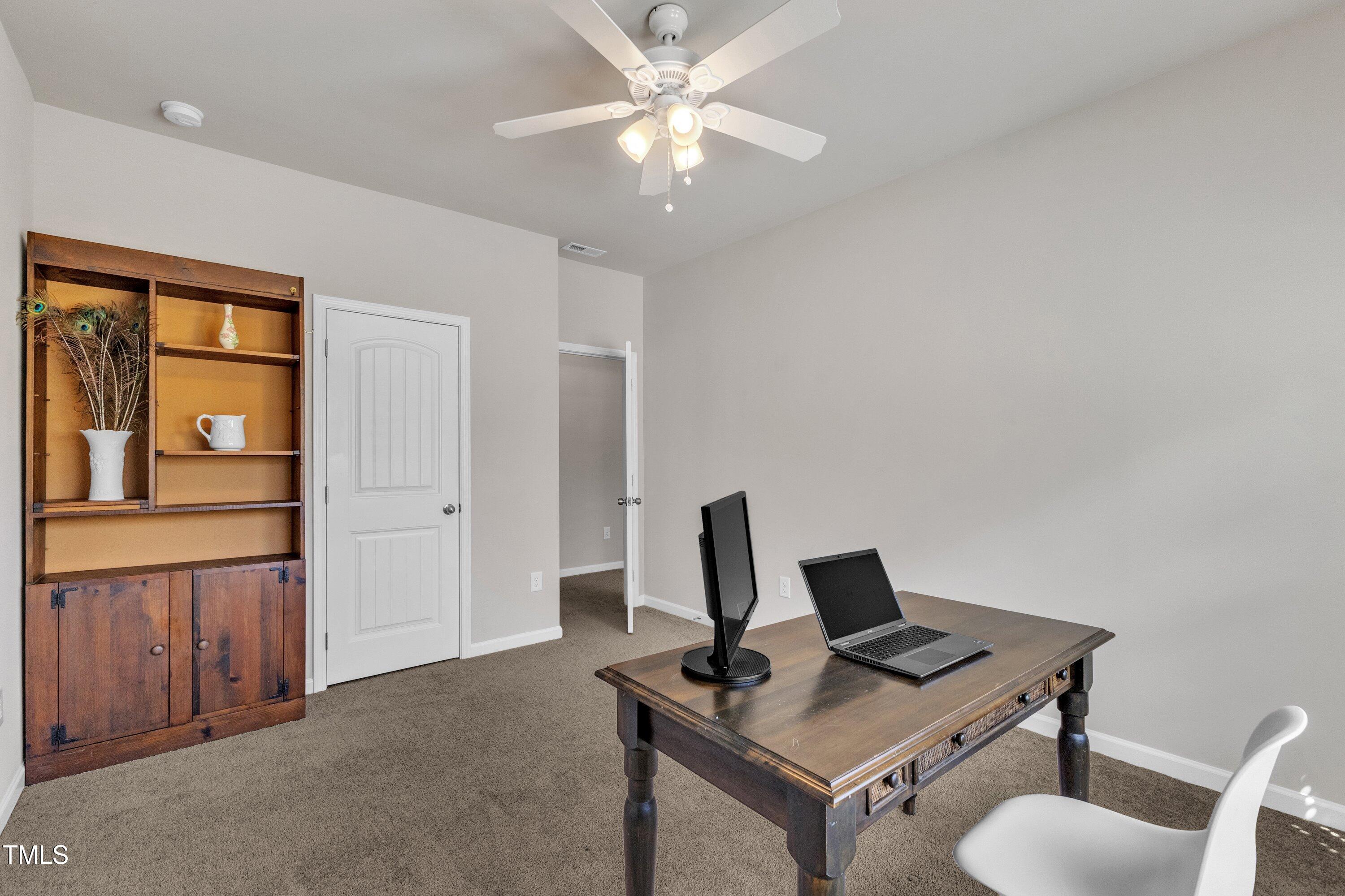 1230 Wingstem Place Raleigh, NC 27607 - Photo 29 of 41 a view of a workspace with furniture