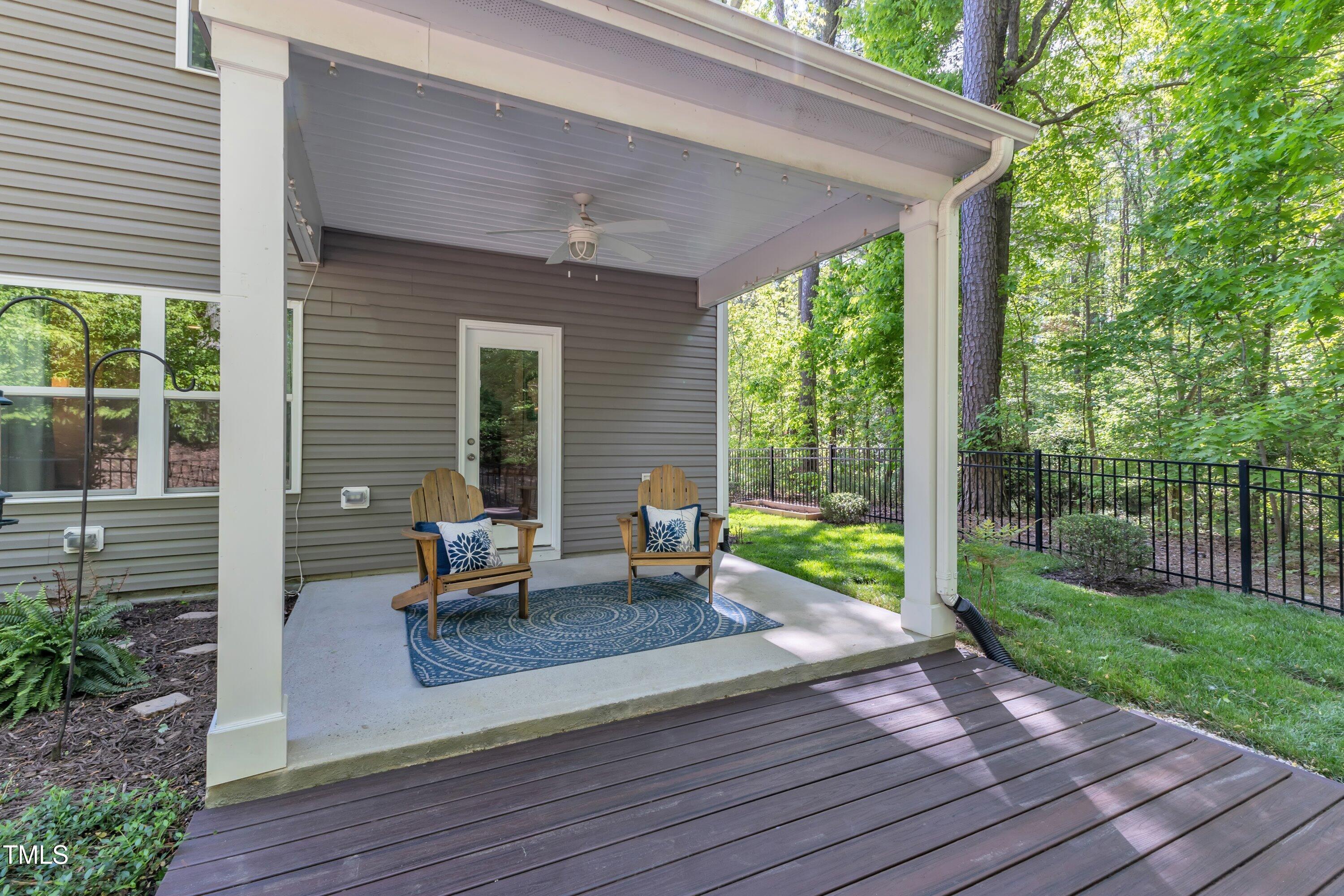 1230 Wingstem Place Raleigh, NC 27607 - Photo 33 of 41 a view of a house with backyard sitting area and garden