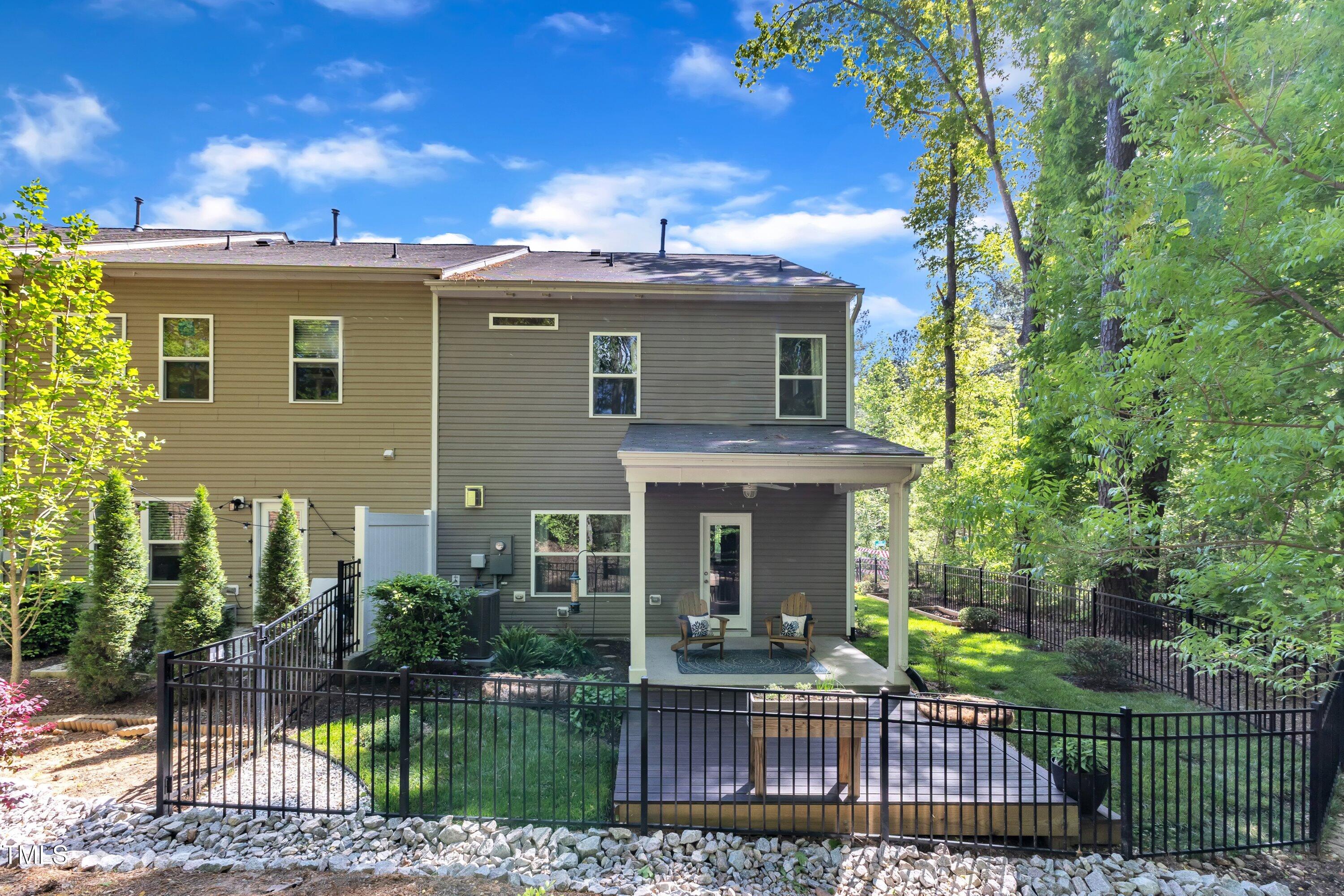 1230 Wingstem Place Raleigh, NC 27607 - Photo 35 of 41 front view of a house with a garden