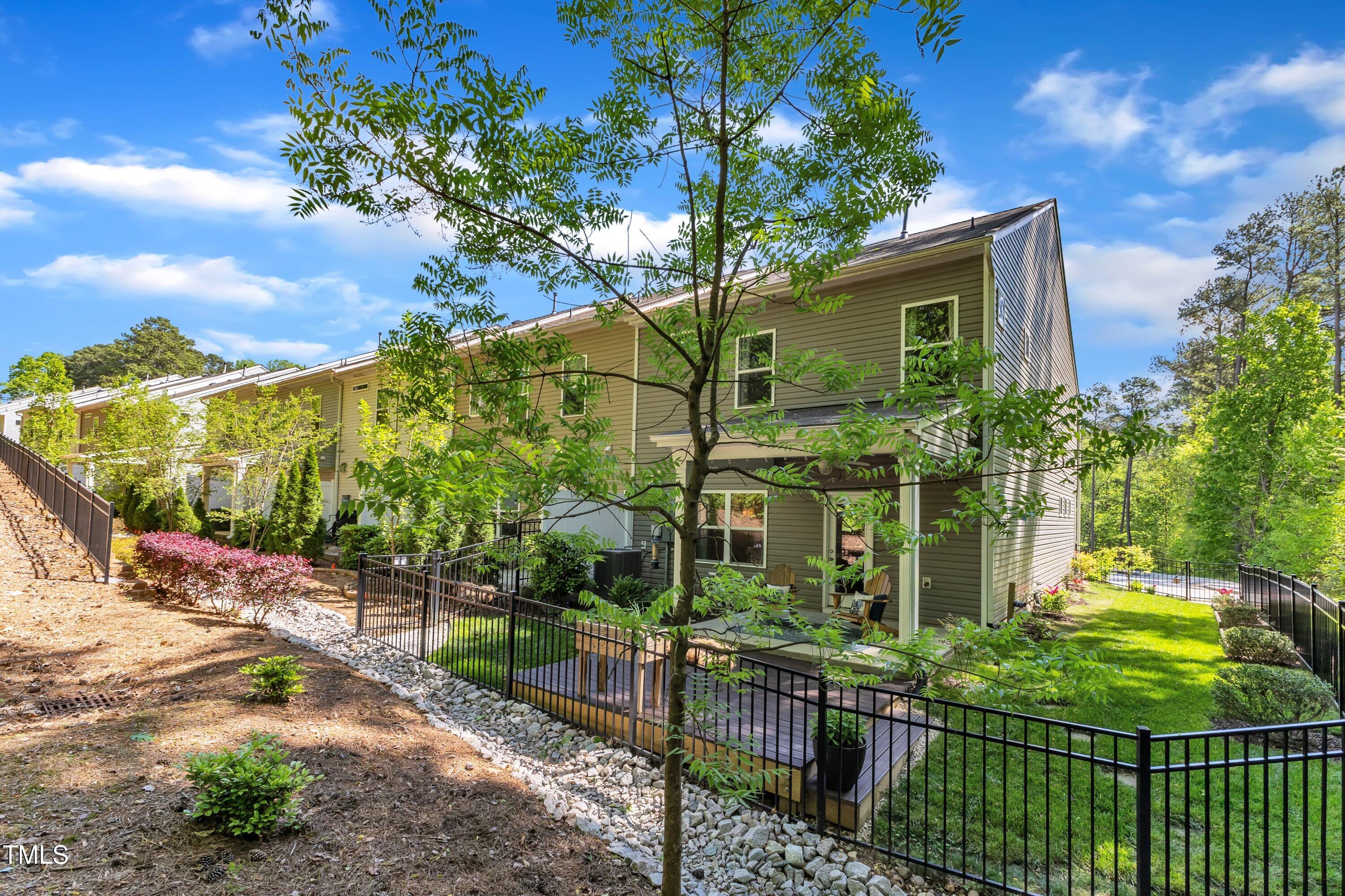 1230 Wingstem Place Raleigh, NC 27607 - Photo 36 of 41 a view of a house with many windows