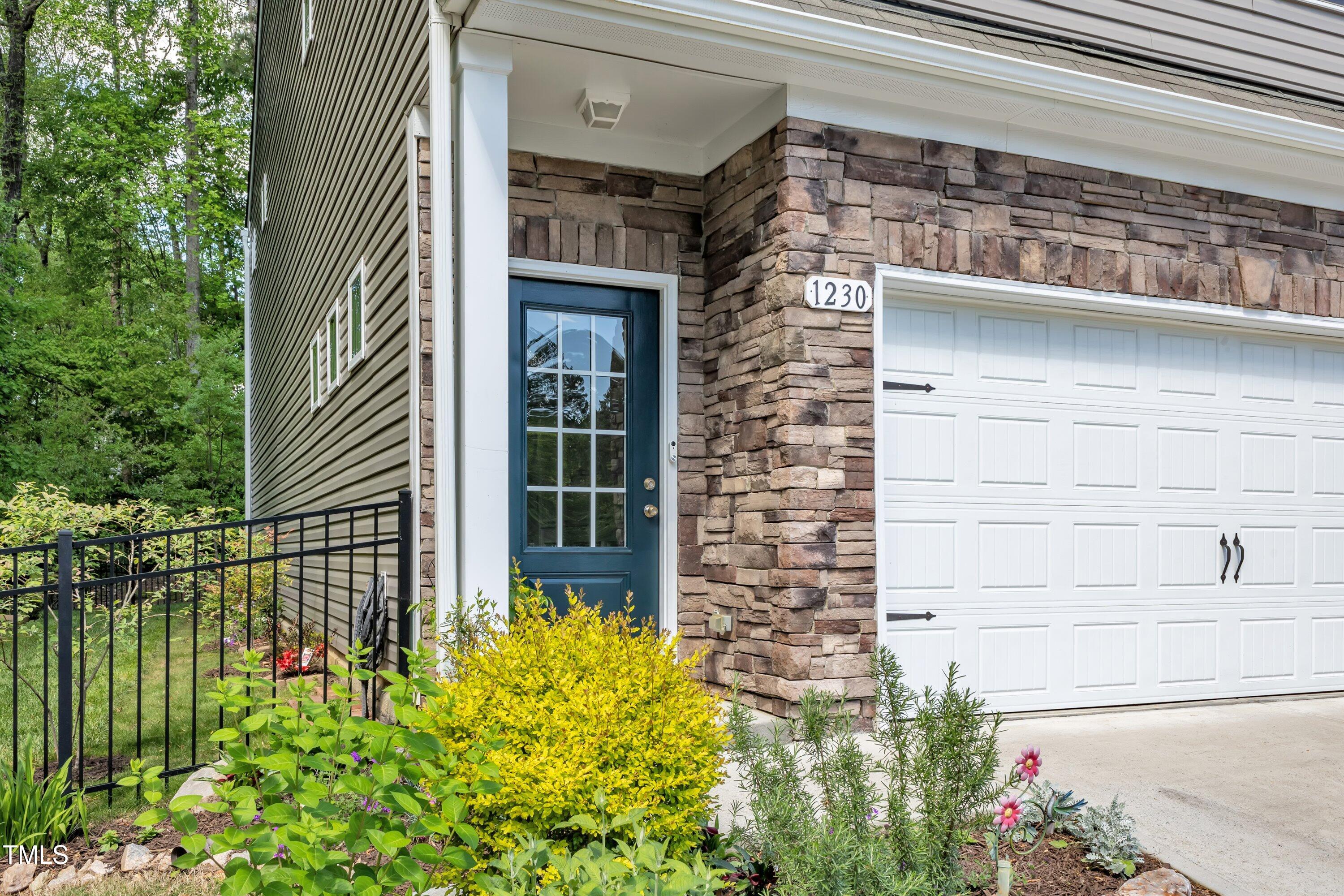 1230 Wingstem Place Raleigh, NC 27607 - Photo 5 of 41 a couple of flower plants in front of building