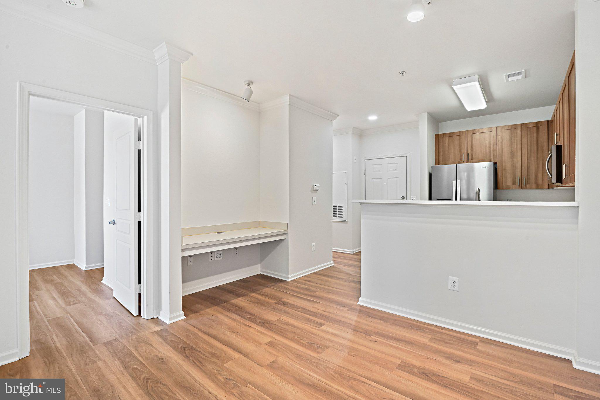 12001 Market Street, Unit 151 Reston, VA 20190 - Photo 6 of 25 a view of a kitchen cabinets and wooden floor