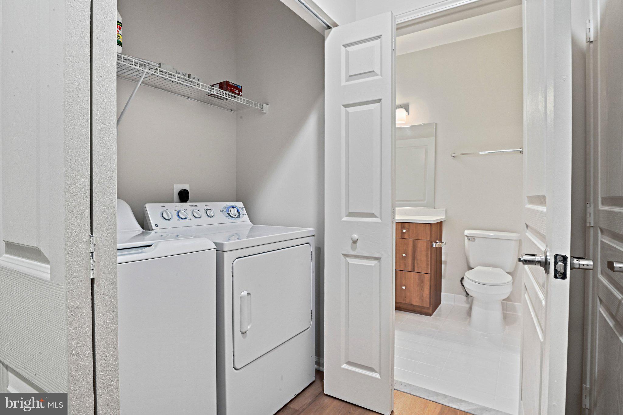 12001 Market Street, Unit 151 Reston, VA 20190 - Photo 10 of 25 a view of bathroom with a washer and dryer