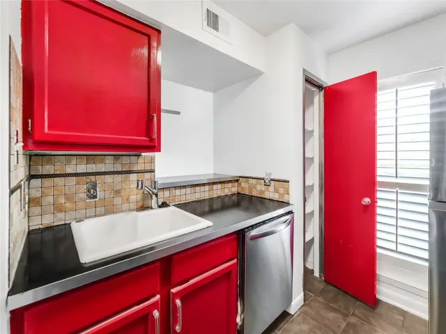 a kitchen with stainless steel appliances granite countertop a stove and a microwave
