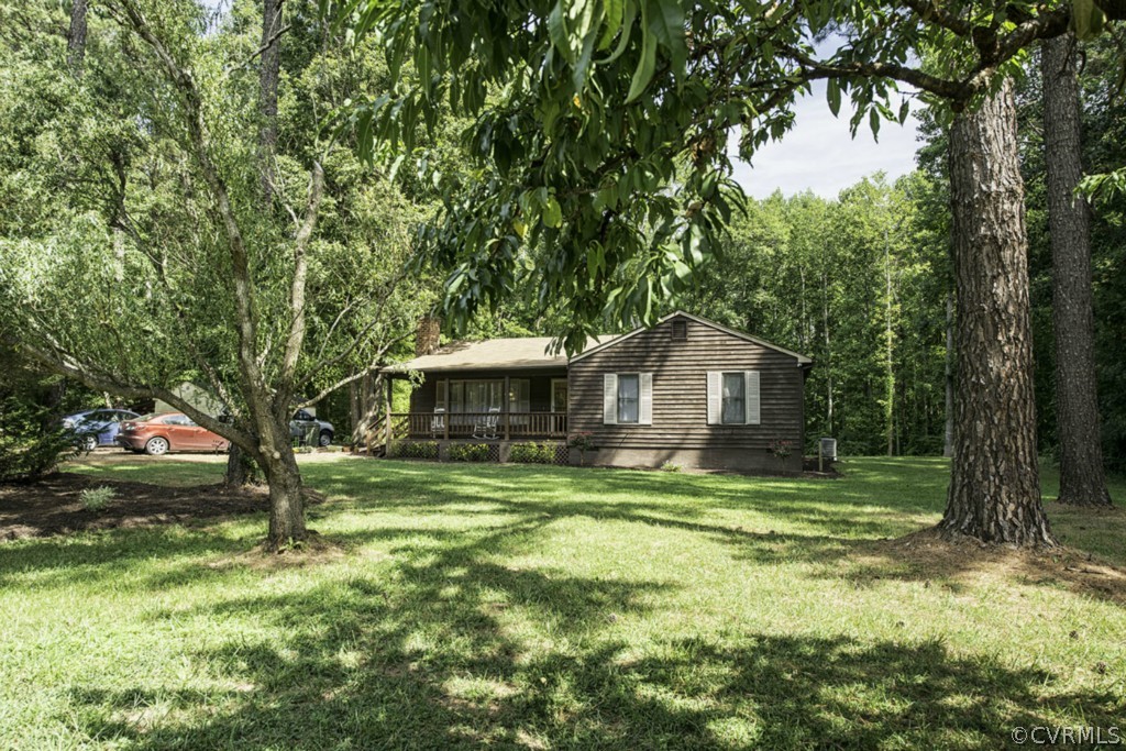 15176 Verdon Road Beaverdam, VA 23015 - Photo 13 of 15 a yellow house in middle of a forest
