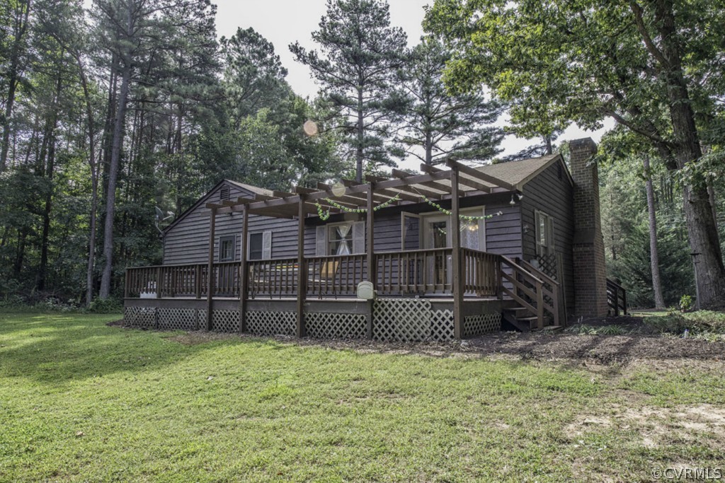 15176 Verdon Road Beaverdam, VA 23015 - Photo 2 of 15 a view of a backyard with wooden fence and large trees