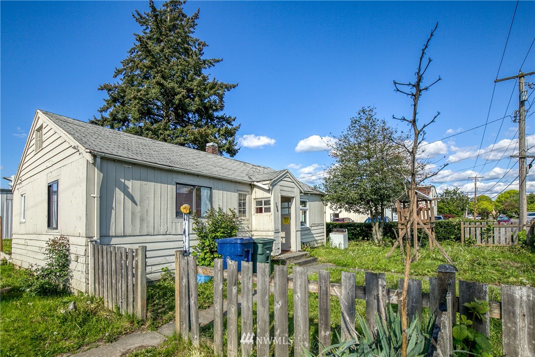 108 South Tobin Street Renton, WA 98057 - Photo 2 of 10 a view of a house with a small yard and plants