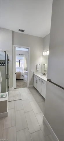 a bathroom with a sink a toilet and mirror