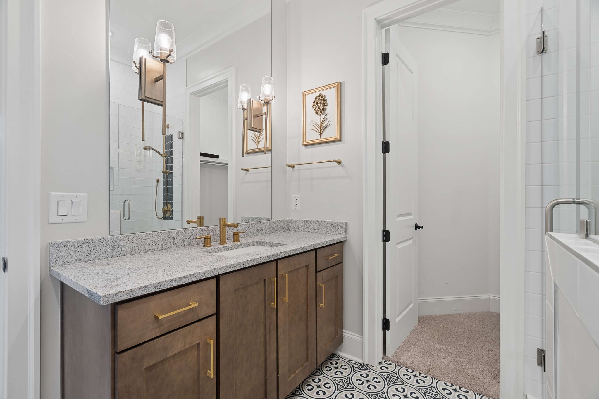 6004 Lookaway Circle Franklin, TN 37067 - Photo 48 of 71 a bathroom with a granite countertop sink a mirror and a shower