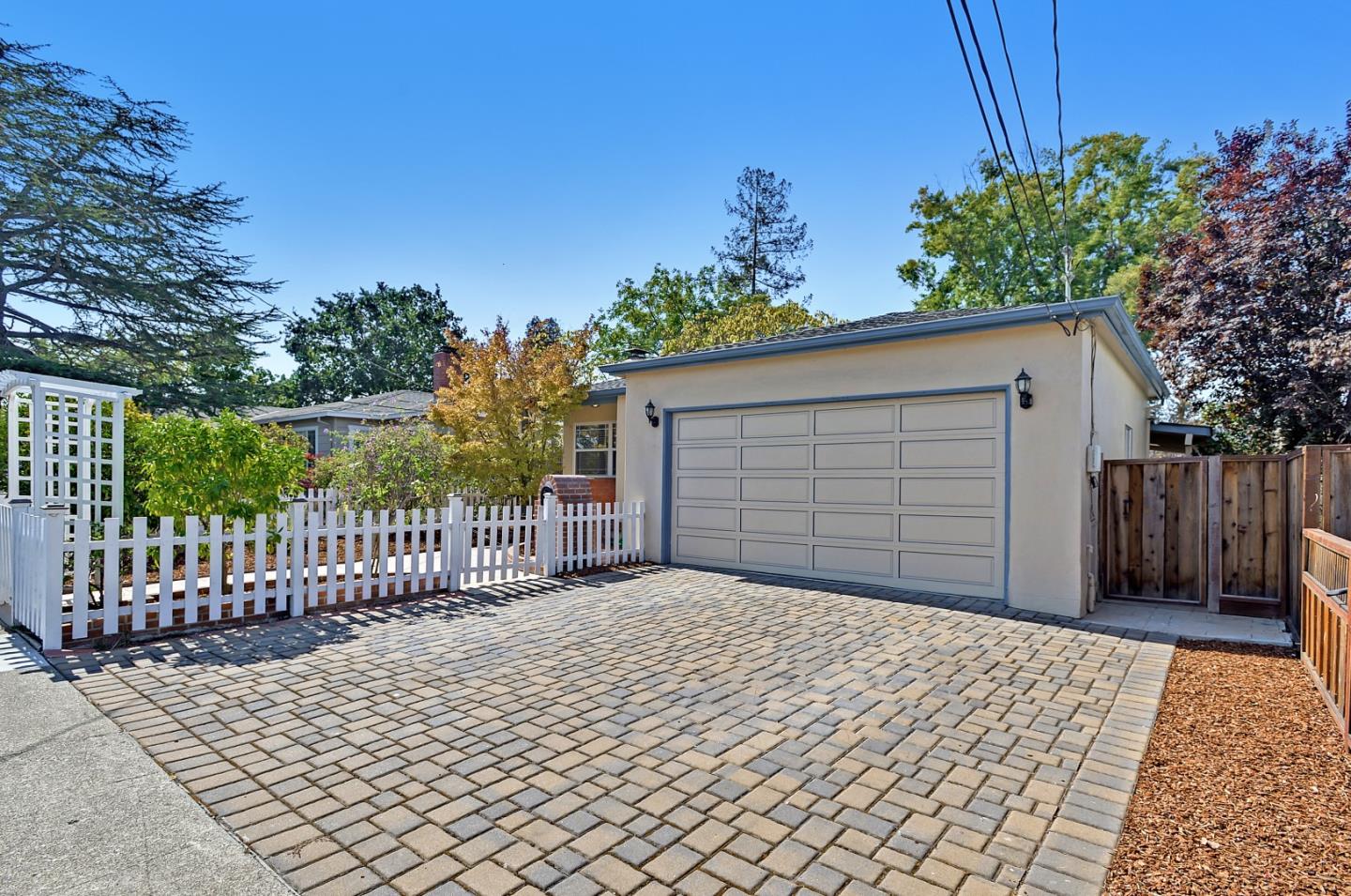 1228 Ruby Street Redwood City, CA 94061 - Photo 1 of 28 a front view of a house having yard