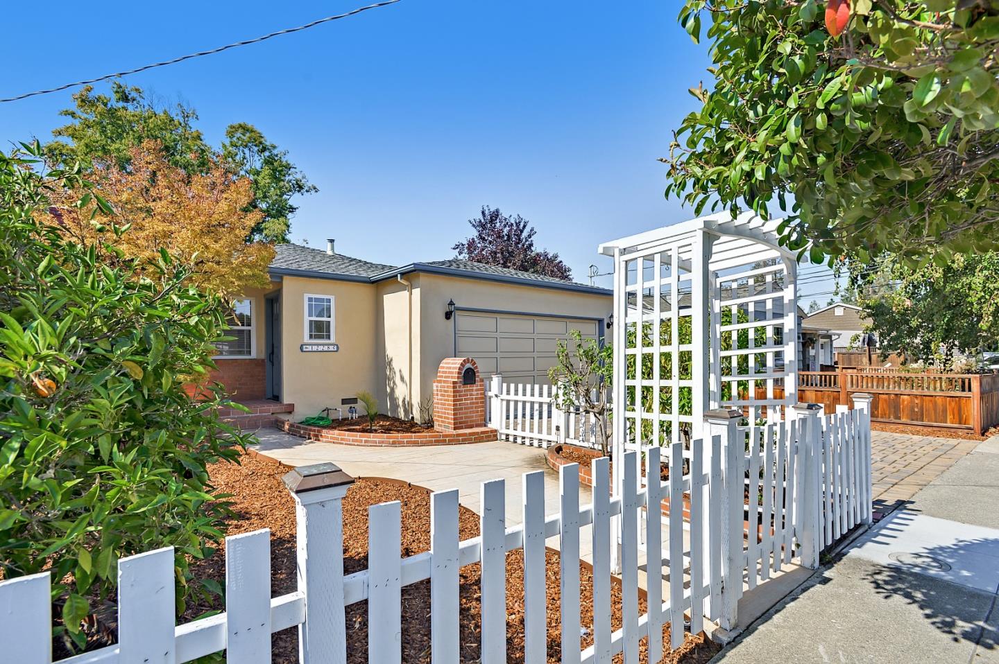1228 Ruby Street Redwood City, CA 94061 - Photo 2 of 28 a view of a house with backyard and sitting area