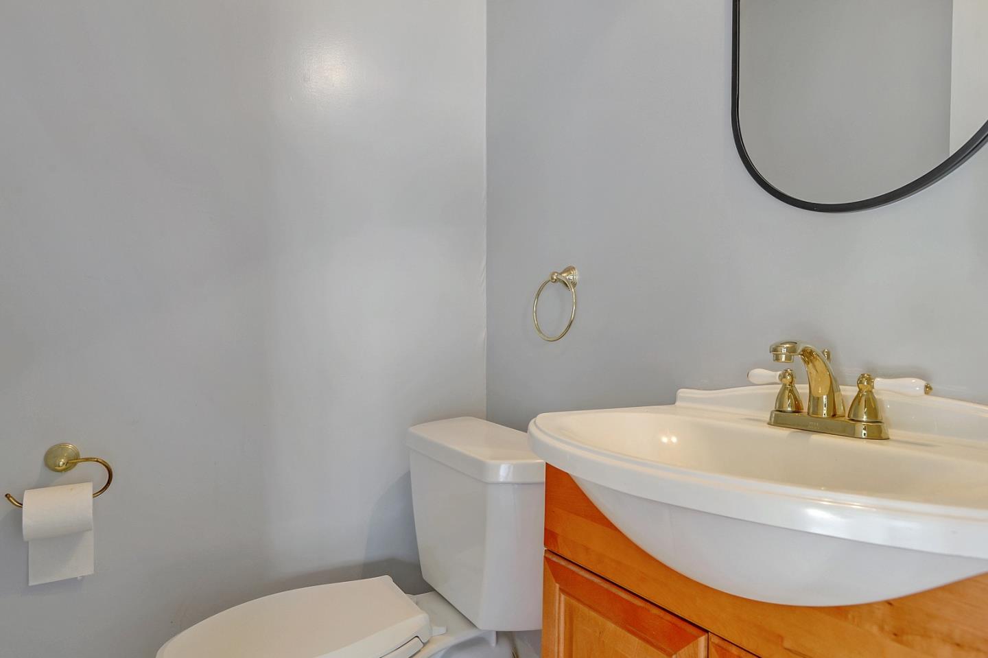 1228 Ruby Street Redwood City, CA 94061 - Photo 20 of 28 a bathroom with a sink and a mirror