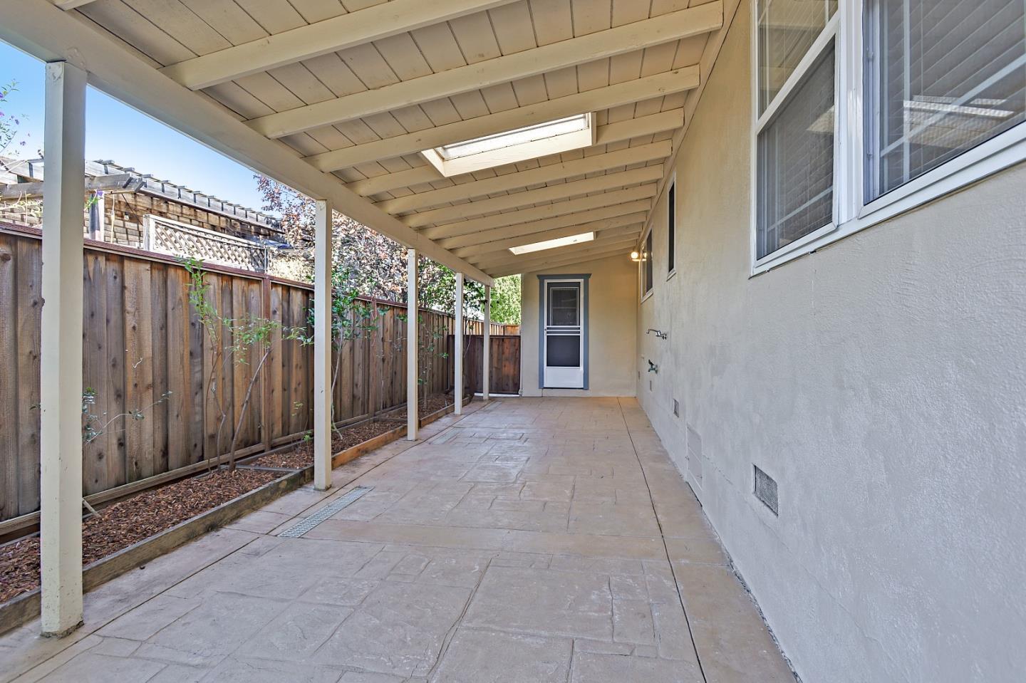 1228 Ruby Street Redwood City, CA 94061 - Photo 23 of 28 a view of a hallway with wooden walls