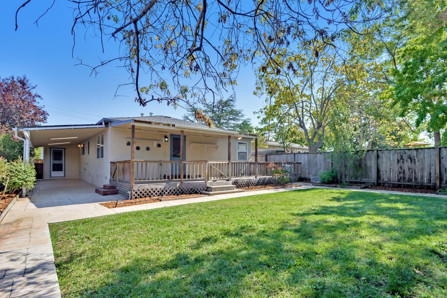 1228 Ruby Street Redwood City, CA 94061 - Photo 26 of 28 a view of a backyard with a sitting area and a small yard