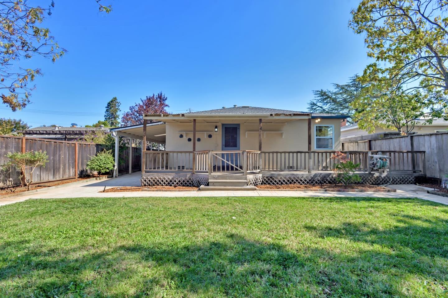 1228 Ruby Street Redwood City, CA 94061 - Photo 27 of 28 a view of a house with a yard and sitting area