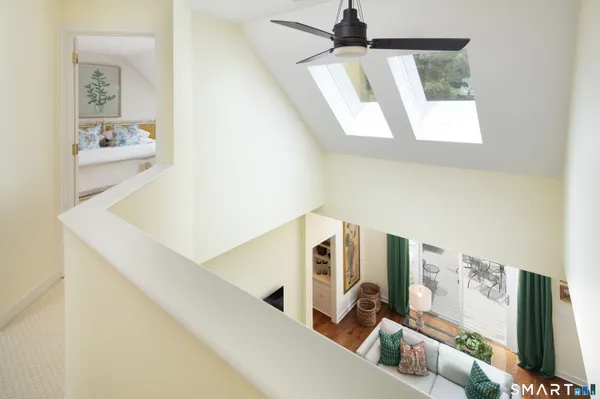 a view of living room with furniture and a window