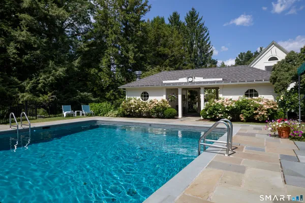 a front view of house with yard and outdoor seating