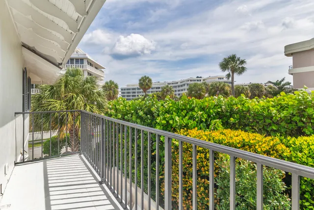 a view of a balcony with a flower plants