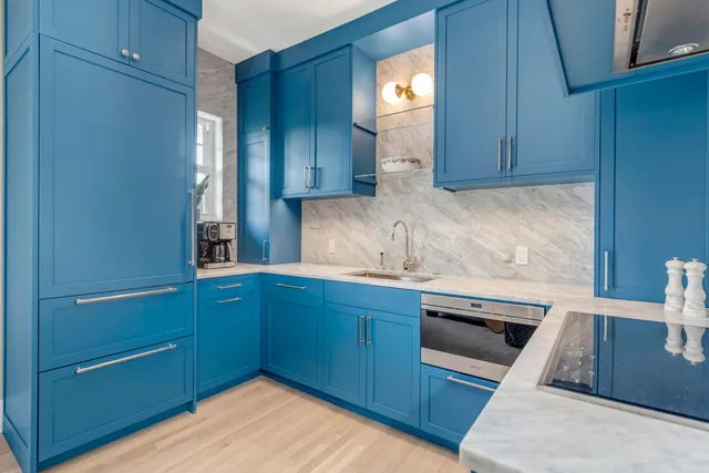 a kitchen with wooden cabinets and a sink