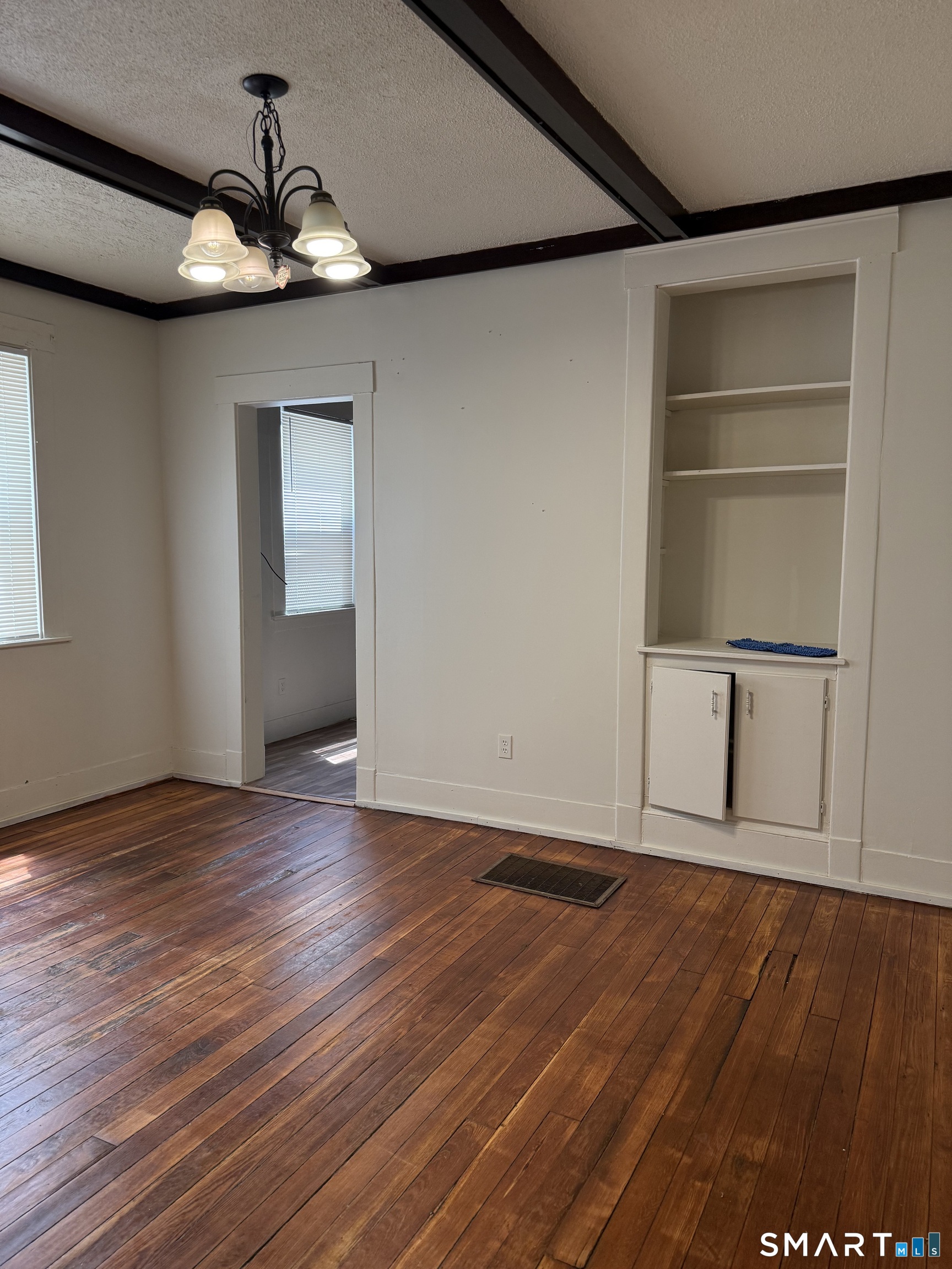 38 Read Street New Haven, CT 06511 - Photo 3 of 10 a view of an empty room with wooden floor and a window
