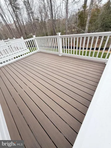 a view of a balcony with wooden floor
