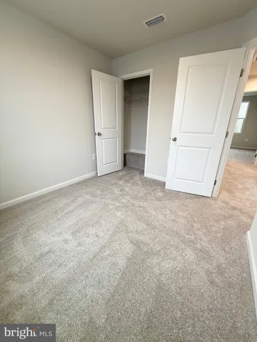 an empty room with an empty space and a window